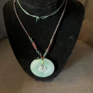 Jadite green and lavender pendant on woven cord